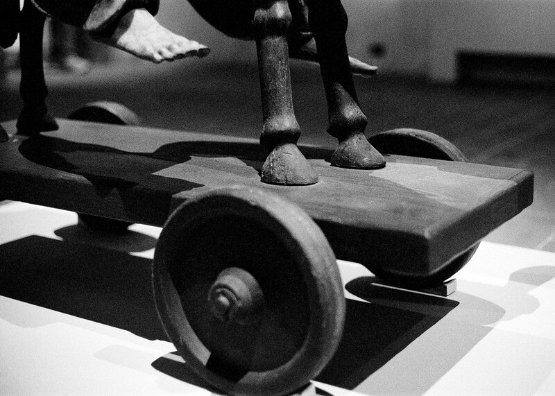 Sculpture of a boy riding a donkey